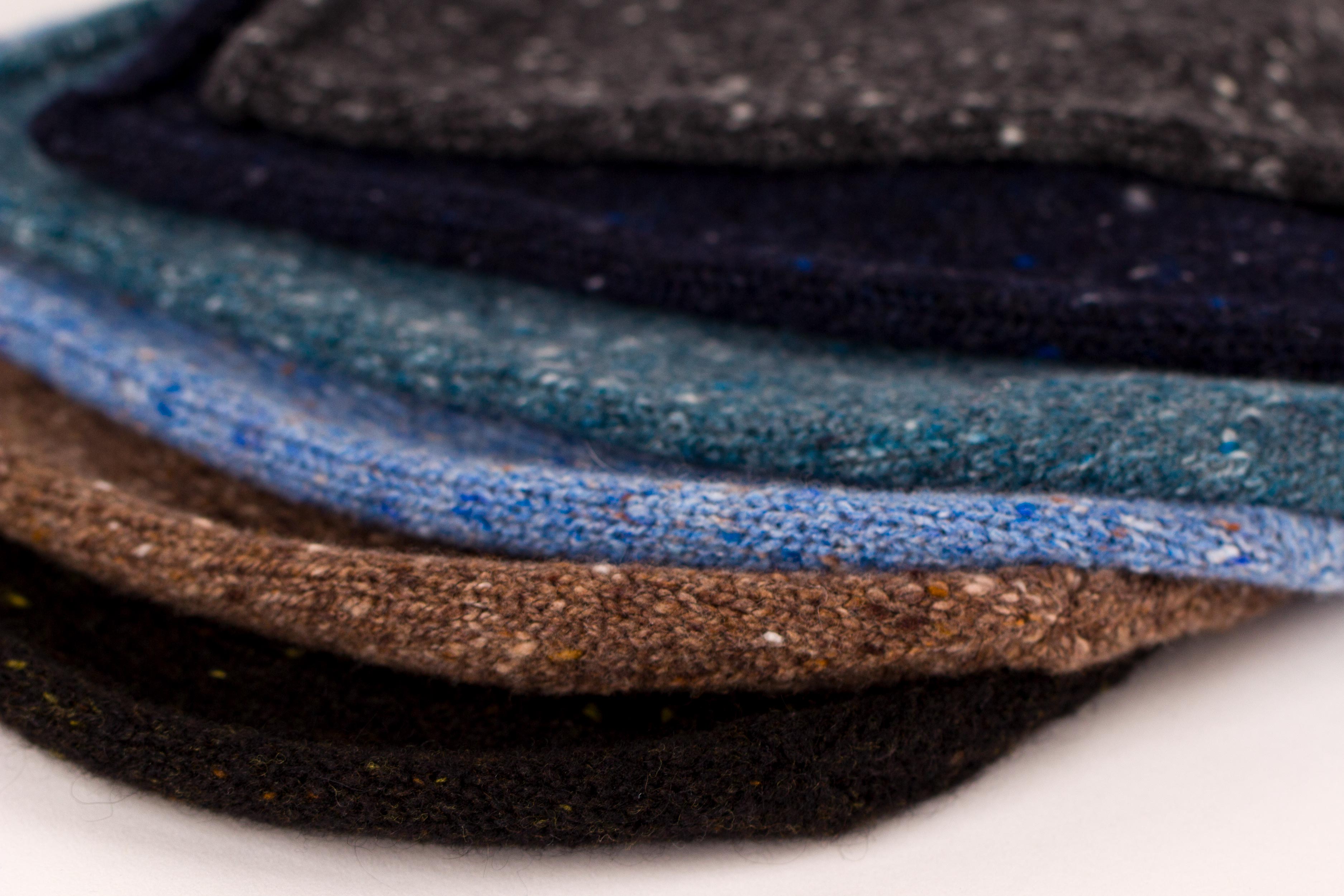 Luxury Scottish-made cashmere knitwear including ribbed snoods, knitted beanie hats, wrist warmers, scarves and Aran or staghorn cable designs