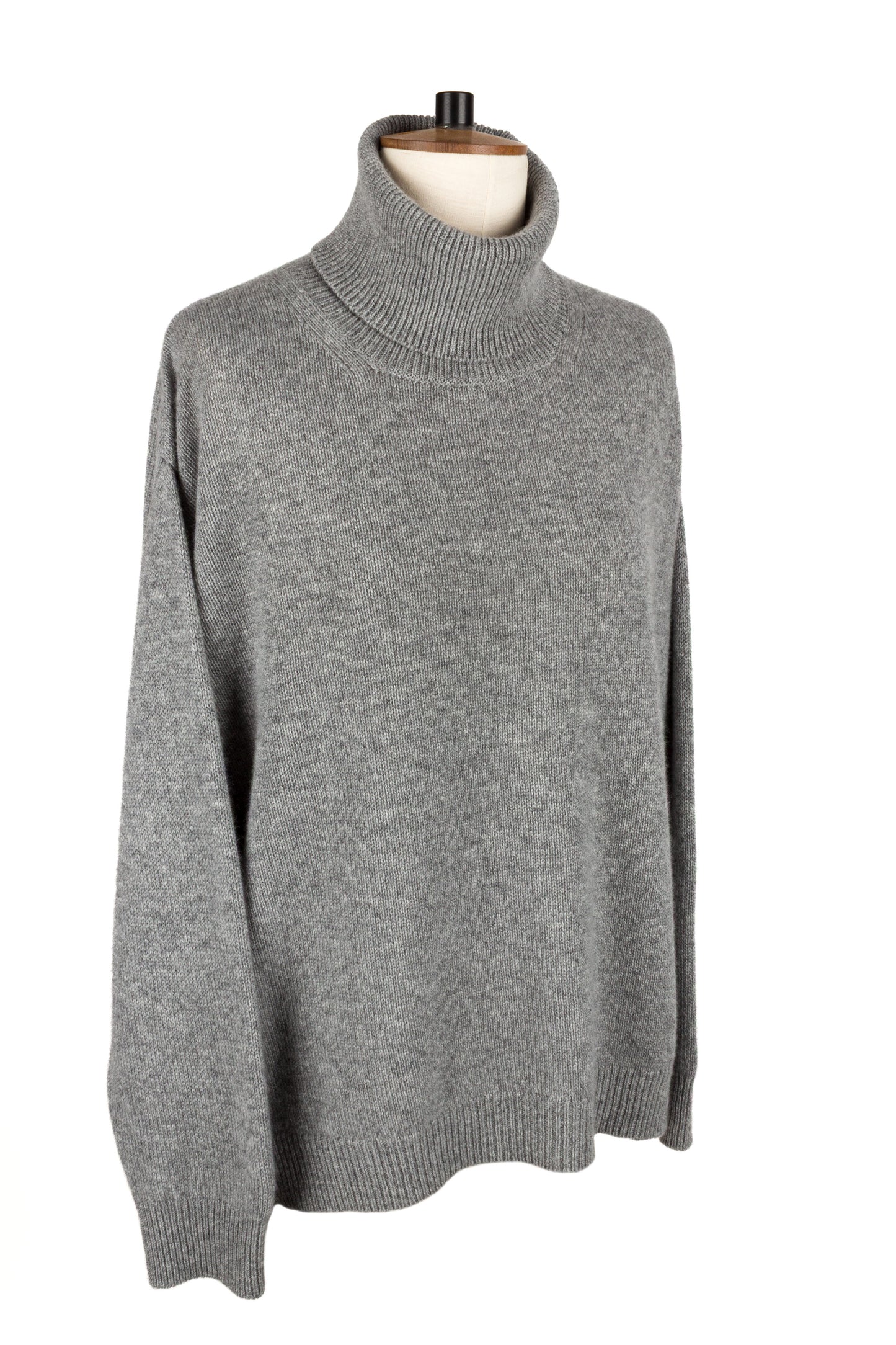 Front side view of women's light grey knitted cashmere roll neck sweater, made in Scotland by Love Cashmere