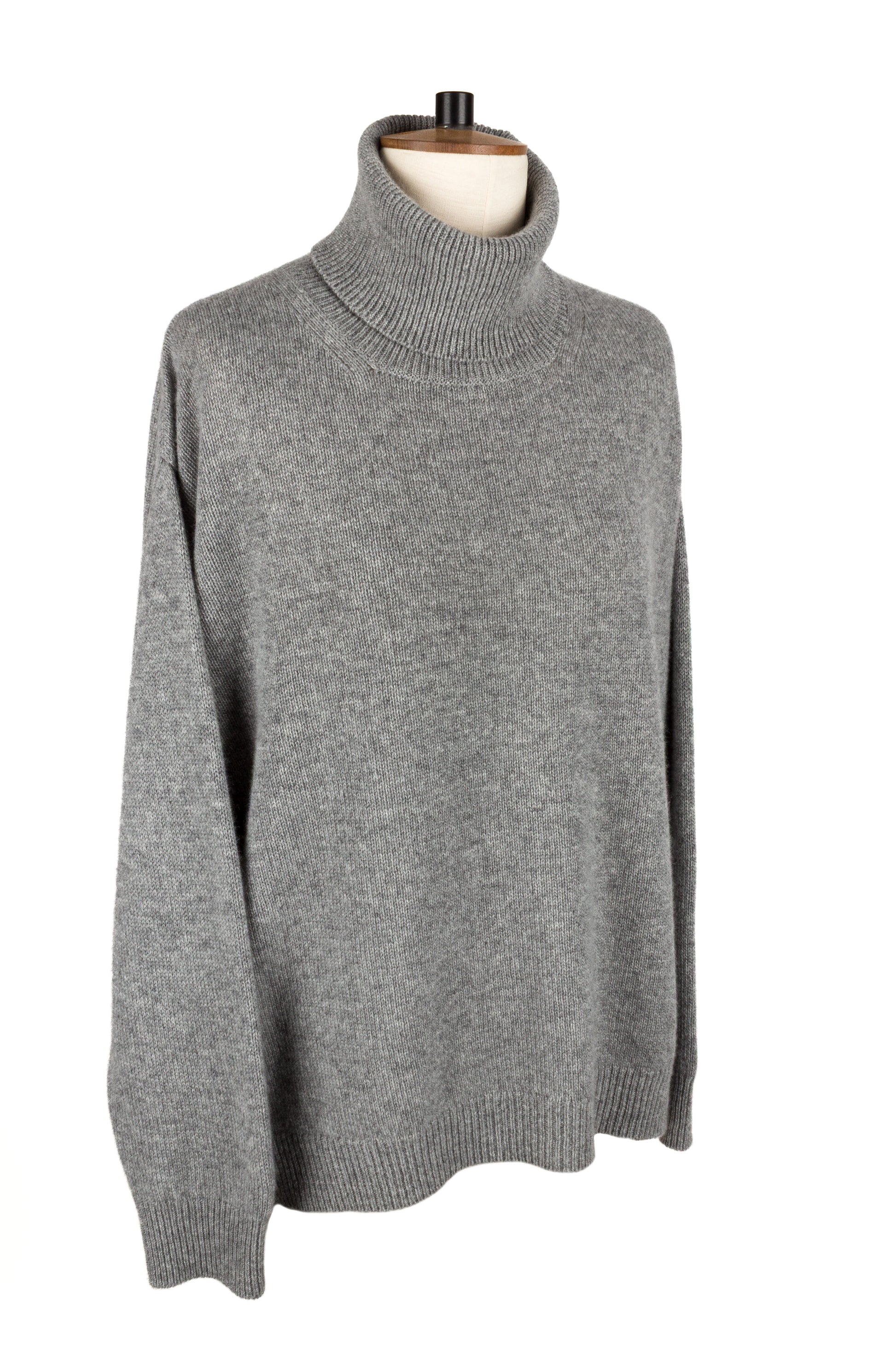 Front side view of women's light grey knitted cashmere roll neck sweater, made in Scotland by Love Cashmere