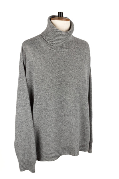 Front side view of women's light grey knitted cashmere roll neck sweater, made in Scotland by Love Cashmere