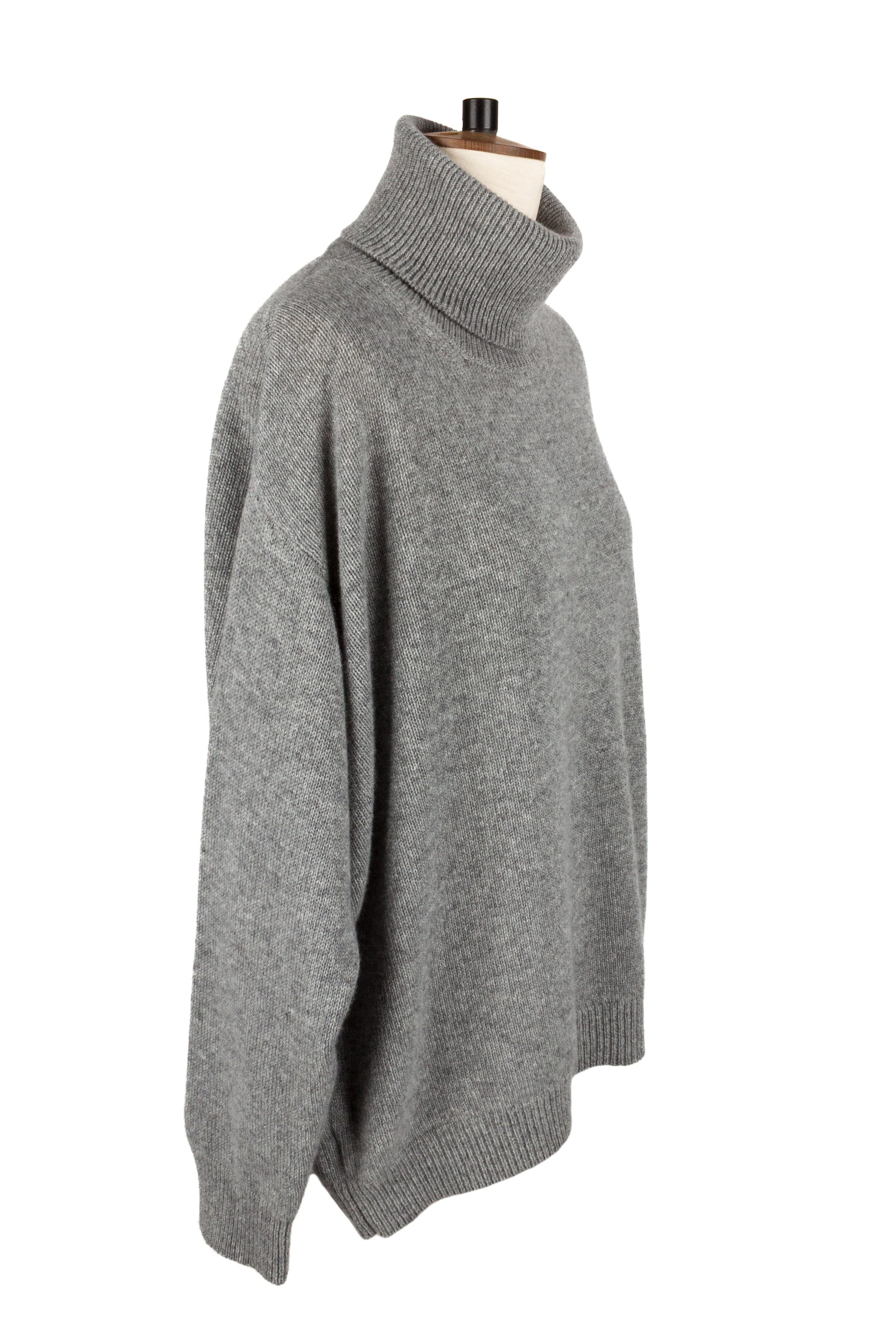 Side view of women's light grey knitted cashmere roll neck sweater, made in Scotland by Love Cashmere