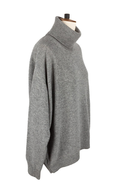 Side view of women's light grey knitted cashmere roll neck sweater, made in Scotland by Love Cashmere